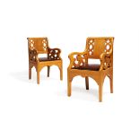 A pair of oak armchairs