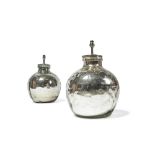 A pair of silver coloured glass table lamps