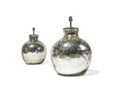 A pair of silver coloured glass table lamps