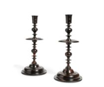 Y A pair of oversized turned ebony candlesticks