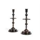 Y A pair of oversized turned ebony candlesticks