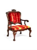 A Portuguese hardwood and red velvet upholstered armchair