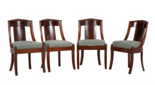 A set of four French Empire mahogany side chairs