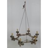 A wrought iron six light chandelier loosely in Medieval taste
