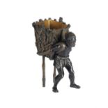 An Austrian bronze figure of an African basket carrier