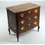 A Continental walnut chest of drawers