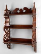 A Victorian mahogany flight of hanging shelves