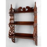 A Victorian mahogany flight of hanging shelves