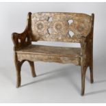A late 19th century French carved beech bench