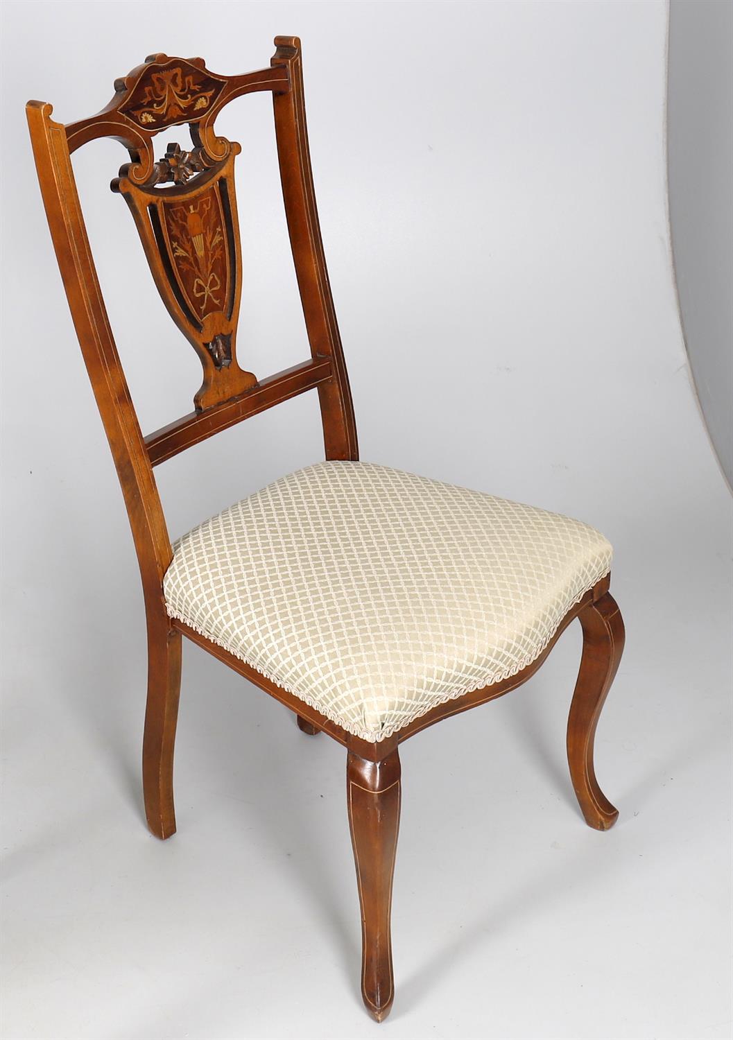 A set of six marquetry inlaid side chairs