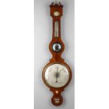 Y An early 19th century faded mahogany wheel barometer