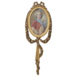 A carved giltwood picture frame in the Louis XVI style