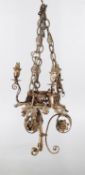 A Continental painted wrought metal three light chandelier