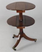 A George III and later mahogany two tier dumb waiter