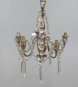 An electroplated metal and cut glass mounted five light chandelier