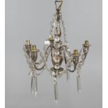 An electroplated metal and cut glass mounted five light chandelier