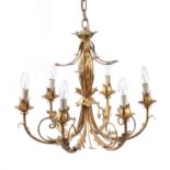 A pressed gilt metal six light chandelier- and pair of pendant lights
