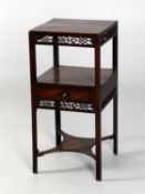 A George III mahogany and fretwork bedside table