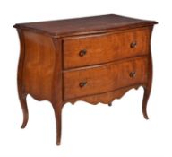 A pair of walnut serpentine chests and matching table