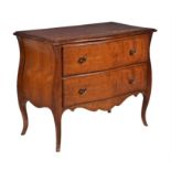 A pair of walnut serpentine chests and matching table