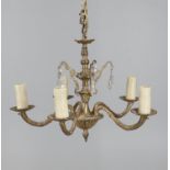 A gilt metal and cut glass five light chandelier