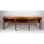 A modern mahogany long writing table