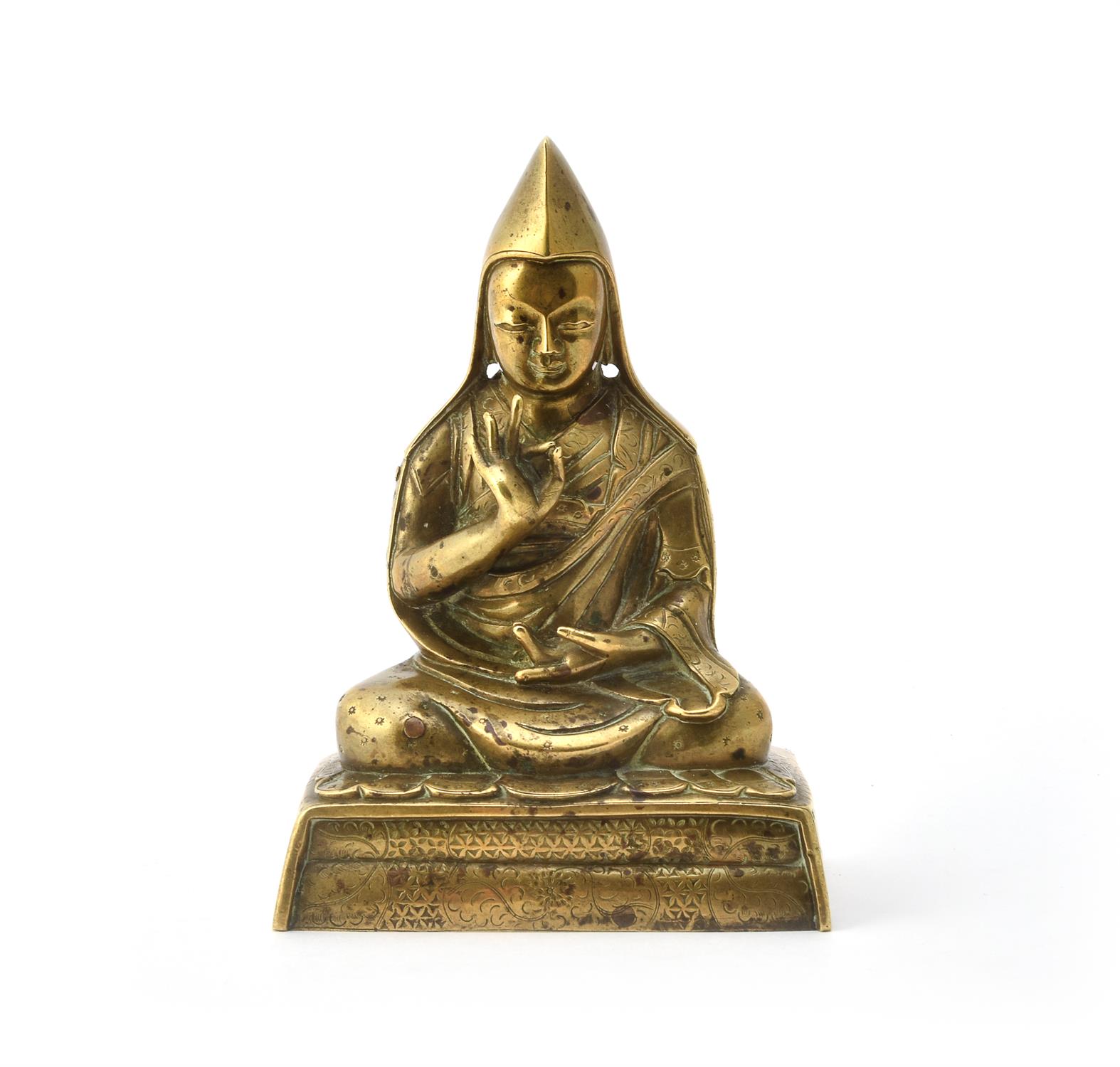 A Sino-Tibetan gilt-bronze seated figure of Tsong Ka Pa