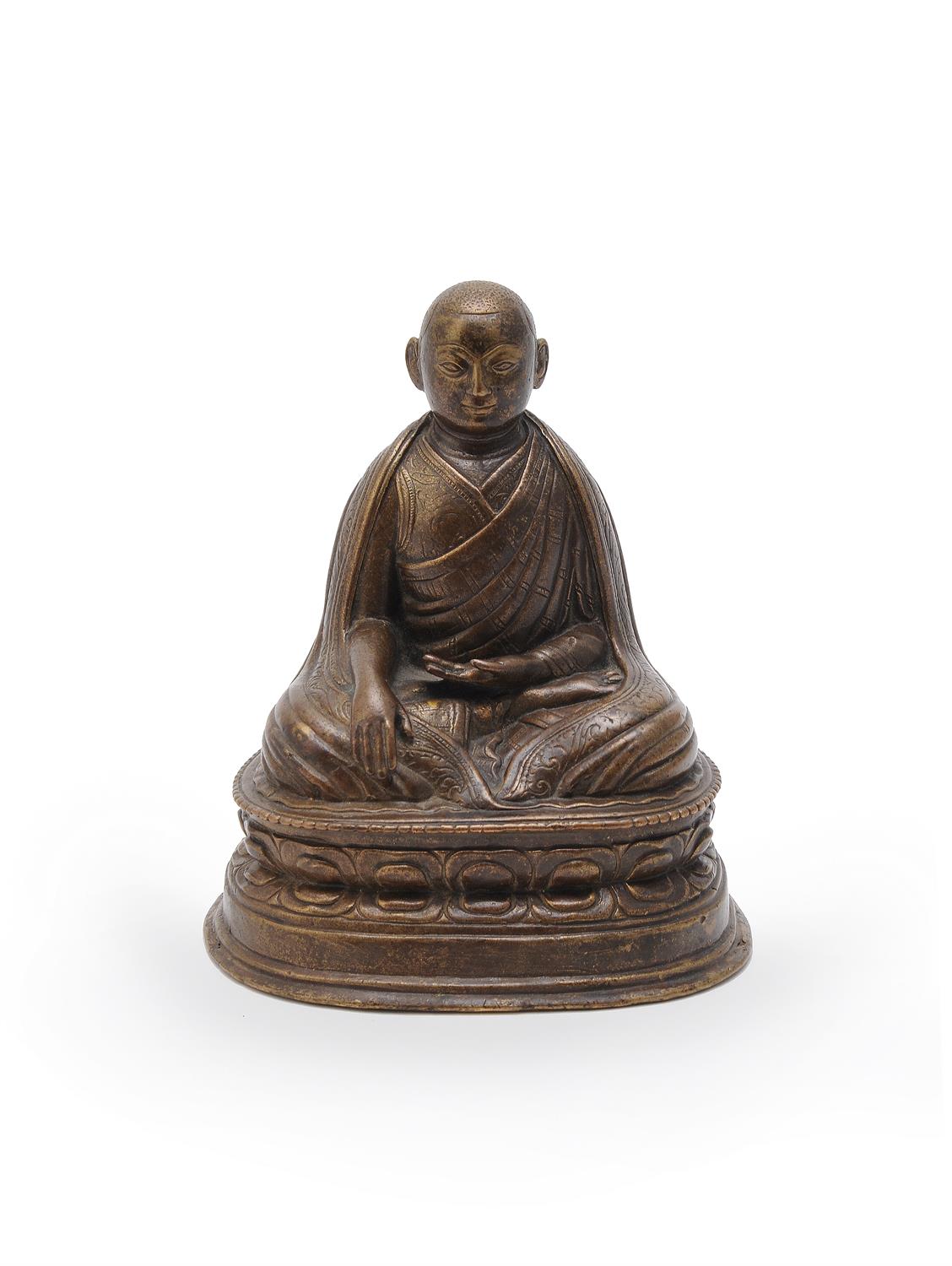 A bronze figure of a Lama