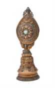 A copper gilt repoussé Buddhist altar ornament
