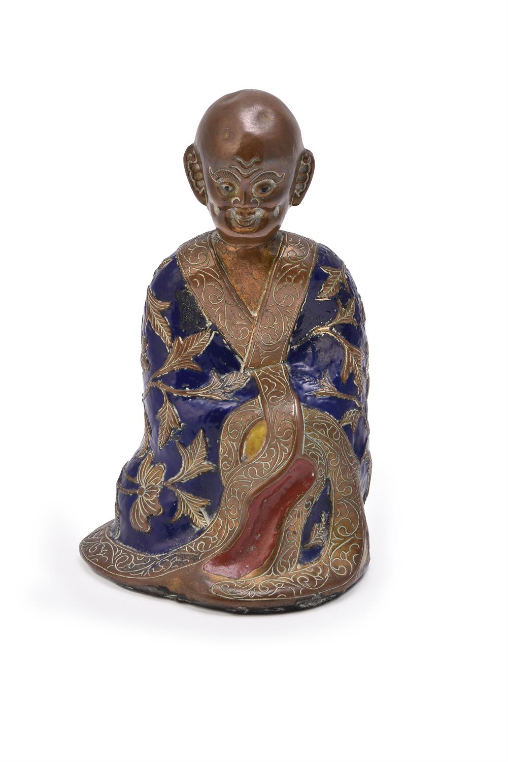 A Chinese gilt bronze and champlev enamel figure of luohan