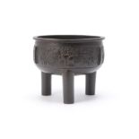 A Chinese bronze tripod censer