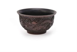 A Chinese carved red and black lacquer 'Dragon' bowl