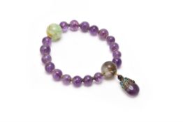 A Chinese amethyst and quartz rosary bracelet