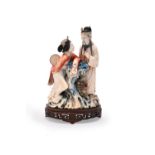 Y A Chinese stained ivory figure group of a court lady and an officer