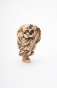 Y A Japanese Ivory Netsuke carved as Hotei