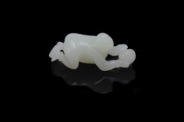 A Chinese white jade carving of a boy