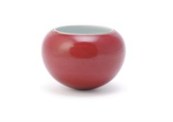 A Chinese red glazed bowl