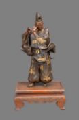 Miya-O Eisuke A Japanese Parcel Gilt Bronze Figure of a Man