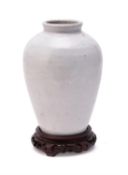 A white glazed stoneware vase