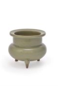 A Chinese celadon tripod censer