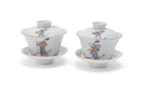 A pair of Chinese famille rose tea bowls and trays