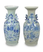 A pair of large Chinese celadon-ground blue and white baluster vases