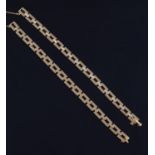 A gold coloured diamond bracelet by M. Gérard