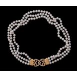 A three strand cultured pearl necklace retailed by Asprey