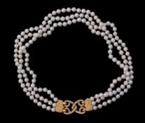 A three strand cultured pearl necklace retailed by Asprey