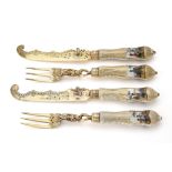 A set of six 19th century German silver gilt and Dresden porcelain dessert knives and forks