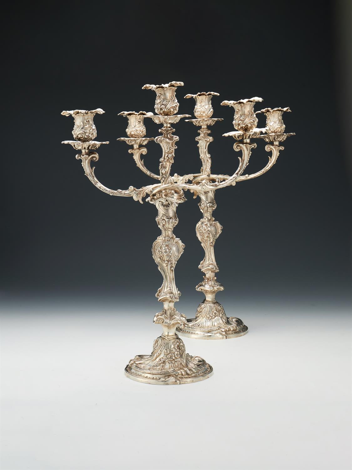 A pair of Victorian silver three light candelabra by Robert Garrard II