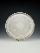 A fine Victorian Aesthetic Movement silver circular salver by Walter & John Barnard