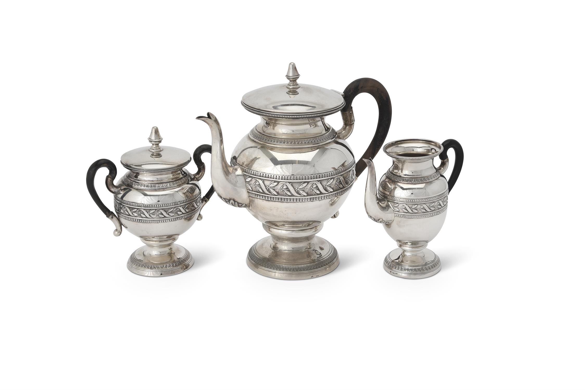 An Italian silver spherical pedestal three piece tea service