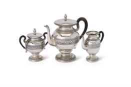 An Italian silver spherical pedestal three piece tea service